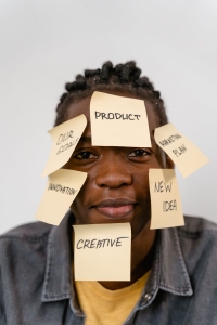 Man in Blue Denim Jacket with Sticky Notes on the Face