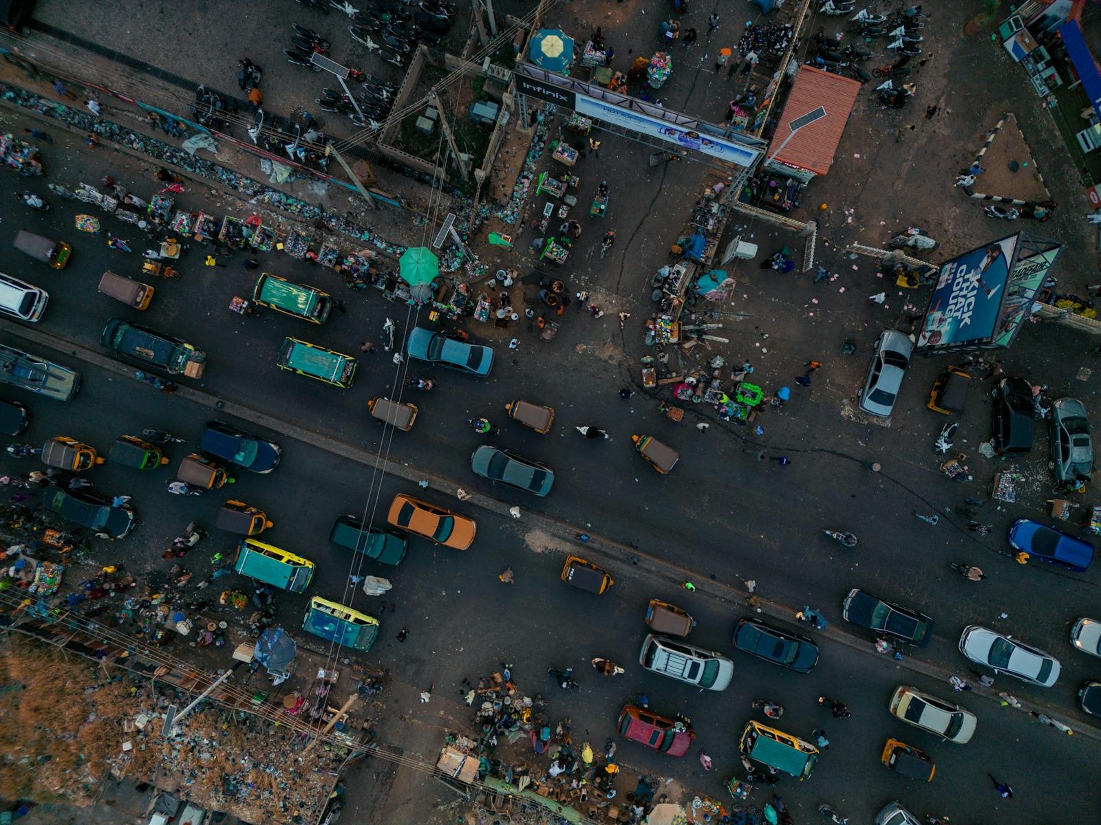 Aerial photo of a busy street market in Kaduna, Nigeria, showcasing vibrant local life.