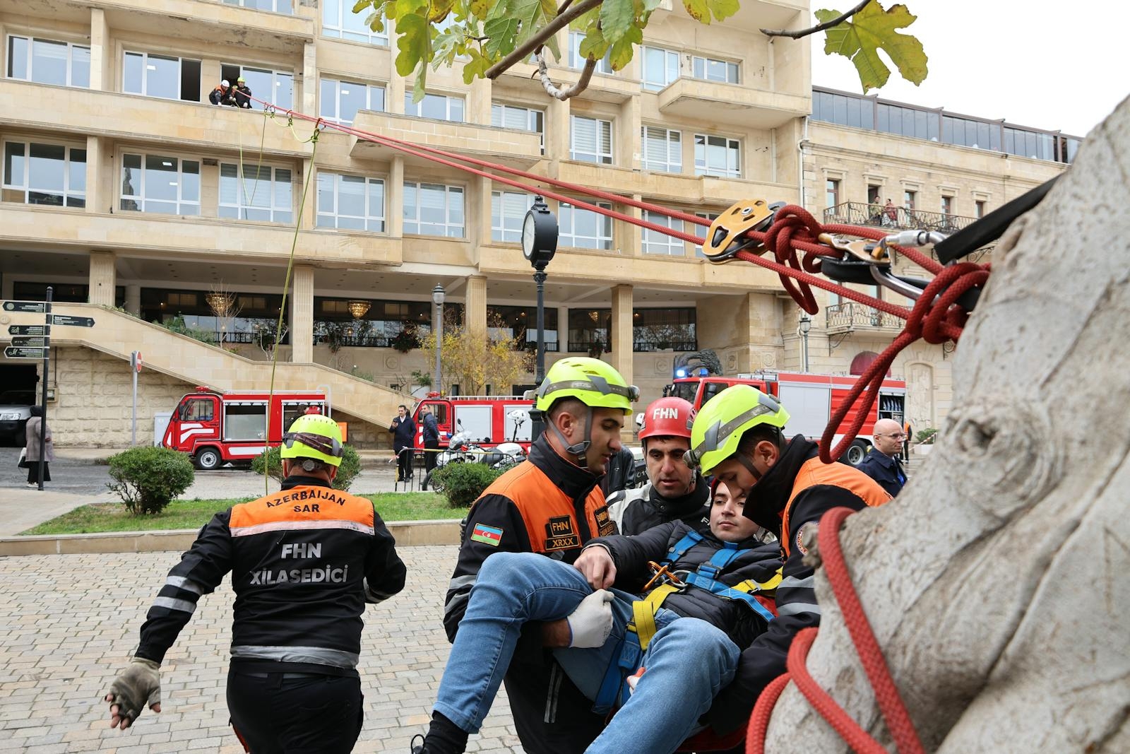 Azerbaijan search and rescue team conducting an outdoor rescue operation using ropes.