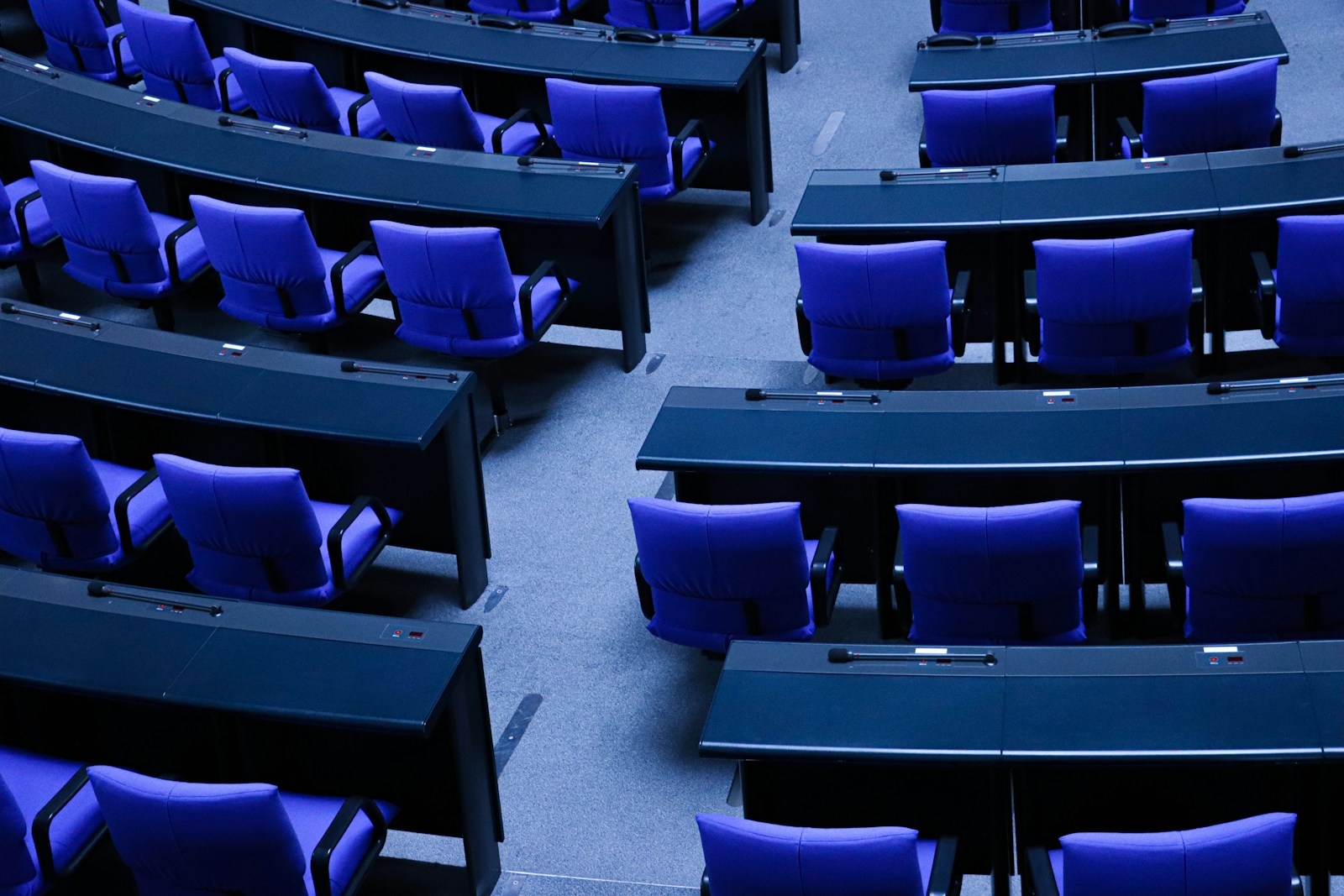 rows of blue chairs in a large room