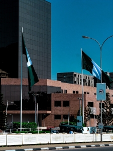 A city street with a lot of flags on the side of it