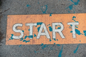 A close up of a street sign on the ground